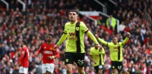 Clarets’ Clutch Penalty Claims Crucial Point at Old Trafford