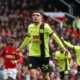 Clarets’ Clutch Penalty Claims Crucial Point at Old Trafford